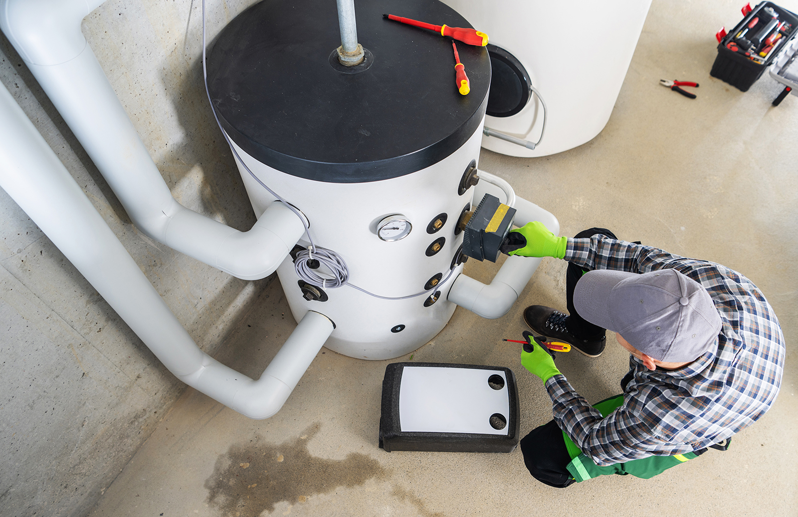 B-Cool technician working on a high-efficiency variable-speed HVAC system in Johns Creek